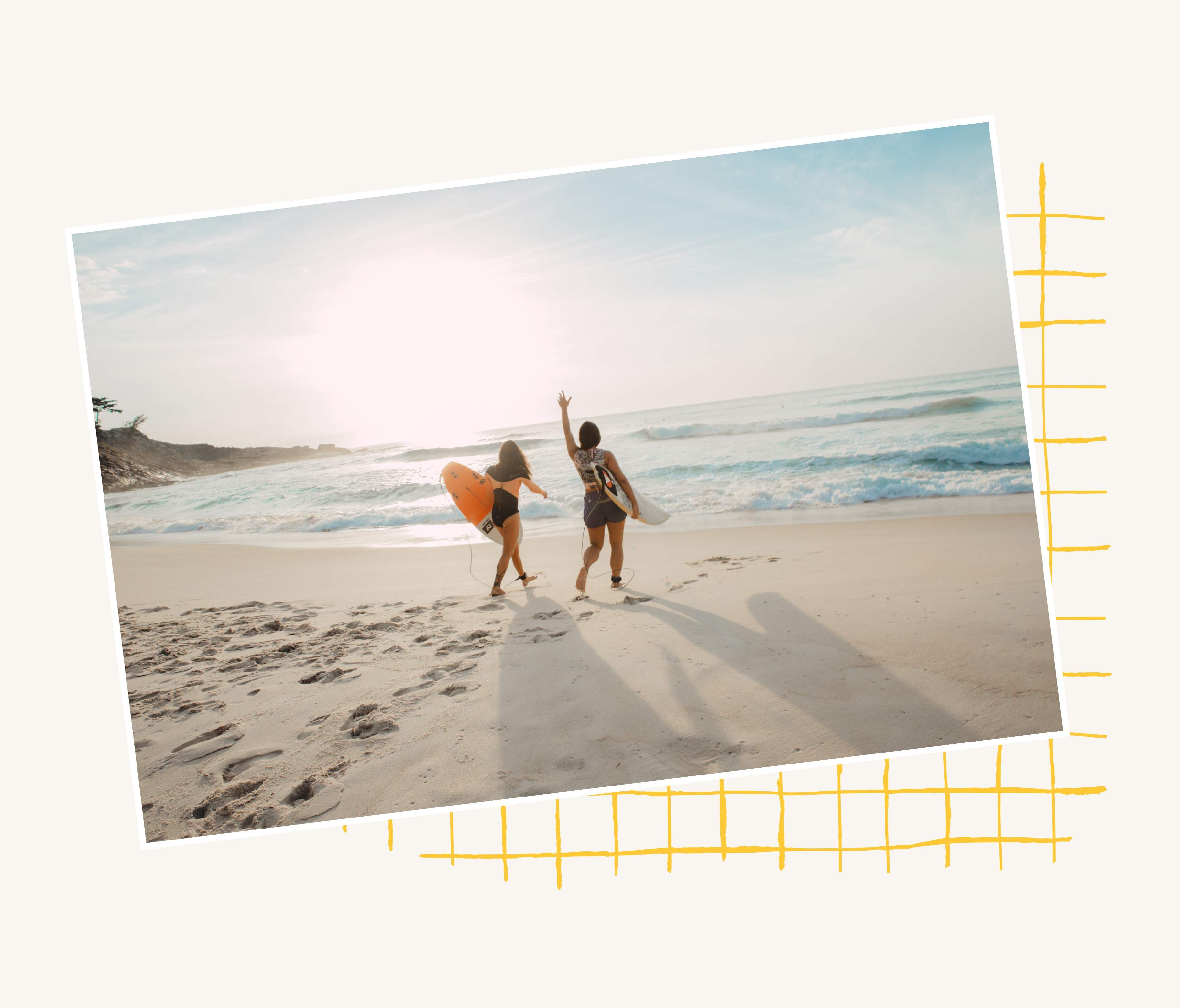 Two surfers walking towards the sea at sunrise, in a tilted photo frame over a hand-drawn yellow grid.